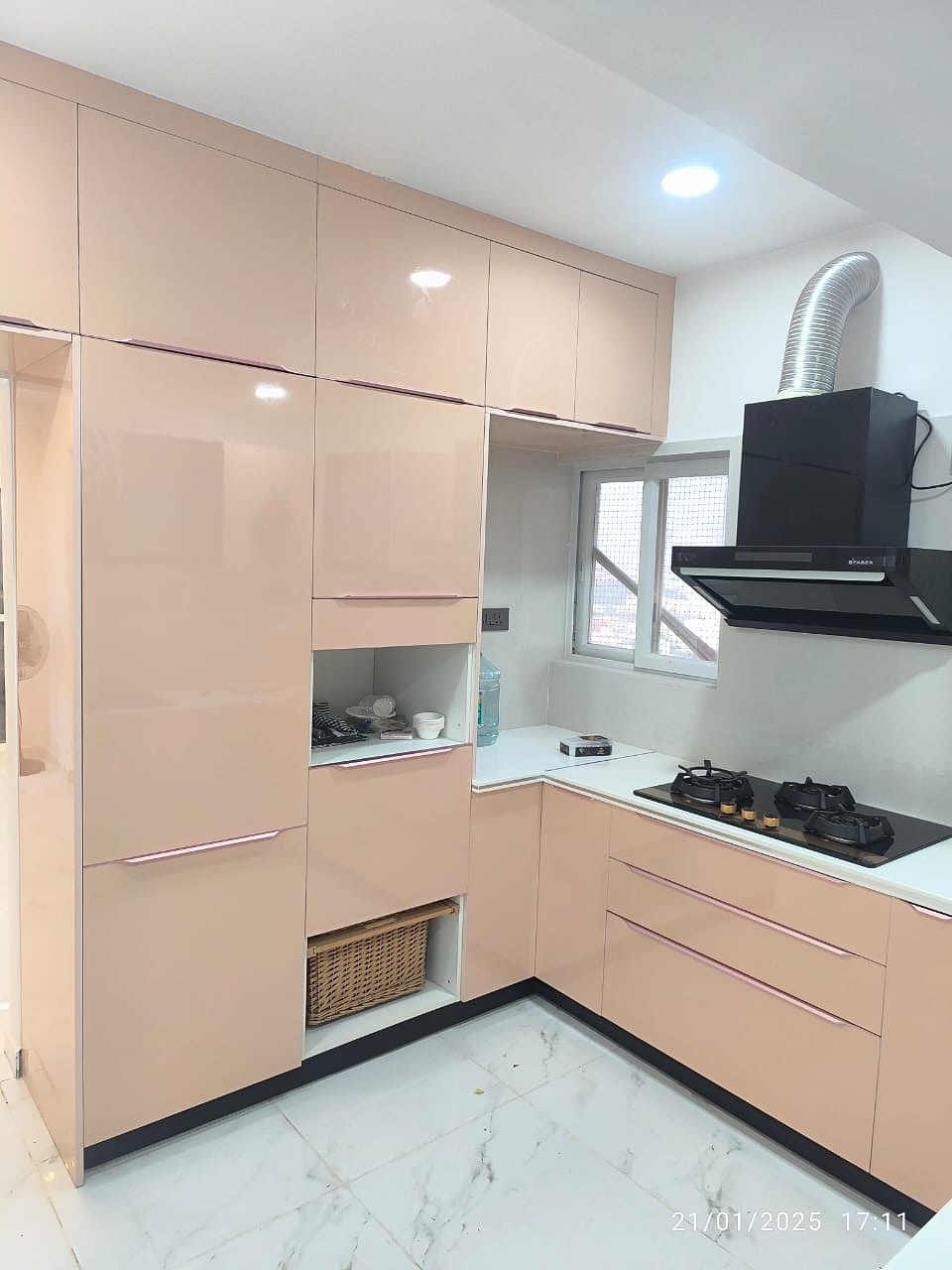 Pink glossy modular kitchen